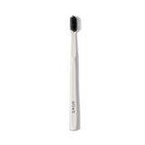 Boka Classic Manual Toothbrush with Extra Soft Activated-Charcoal, Tapered Bristles, Bioplastic Handle that Includes Travel Cap, Dentist-Approved, Neutral-Tone Toothbrush for Uncluttered Counter, White (Pack of 4)